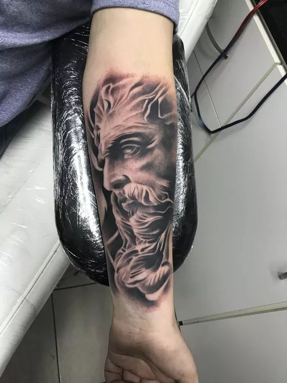 Zeus tattoo design on arm - Design of TattoosDesign of Tattoos